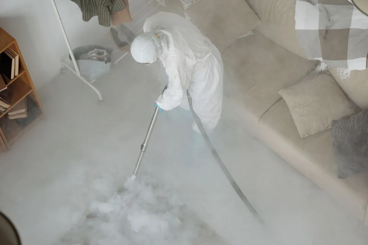 Biohazard cleanup technician in protective equipment, Johnstown, OH